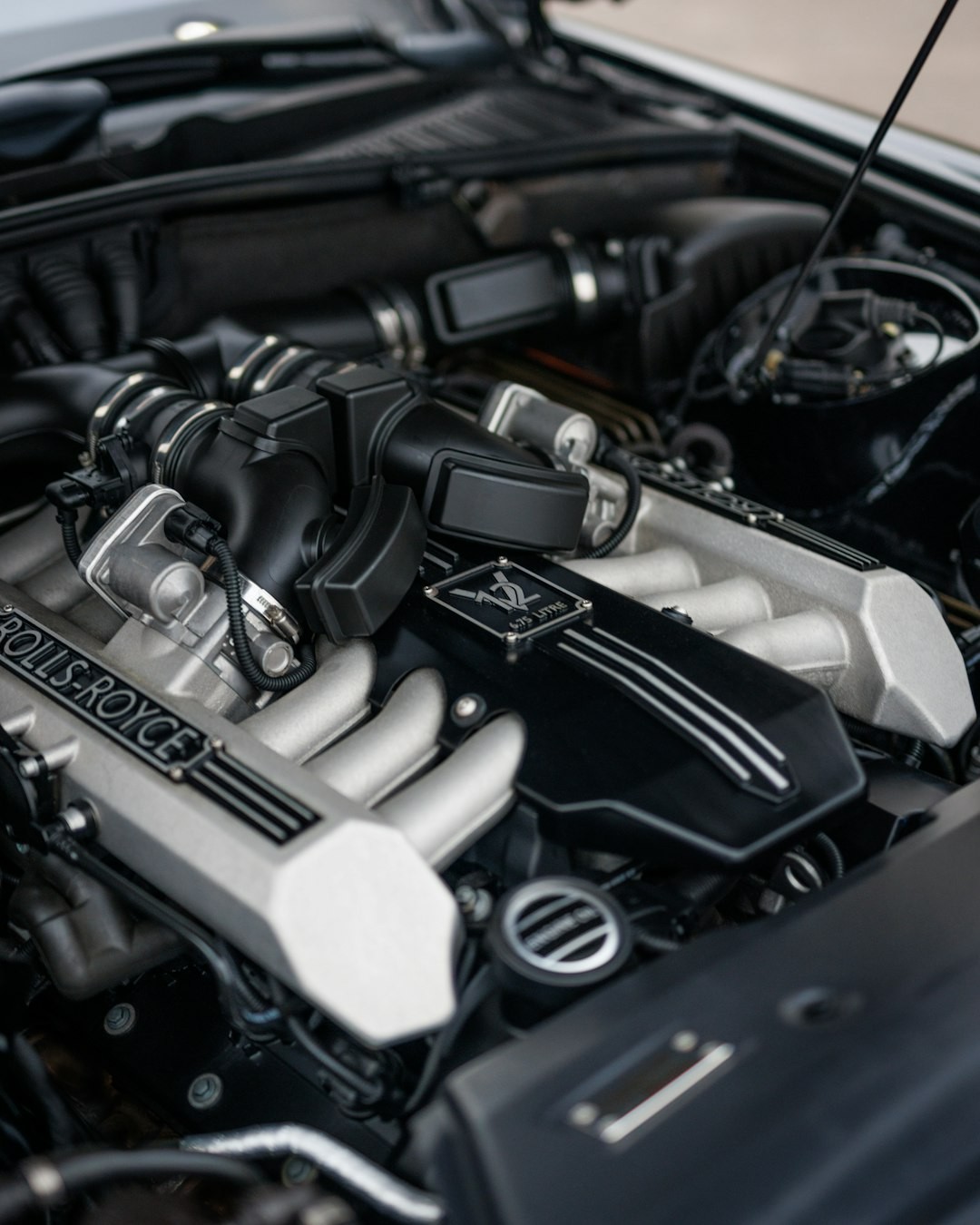 a close up of a car engine with its hood up